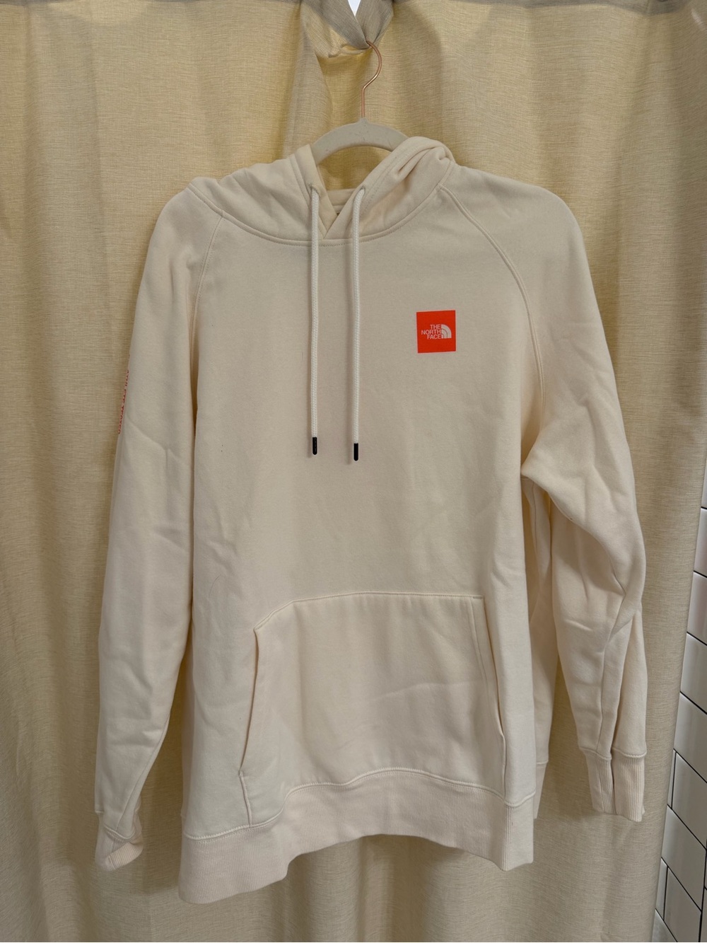 The North Face Men's Cream Crewneck Hoodie with Orange Logo
